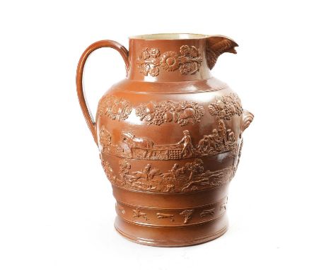 A LARGE SALT-GLAZED STONEWARE PITCHERMID-19TH CENTURYthe eagle-head spout on a neck with applied floral foliage above a bulbo