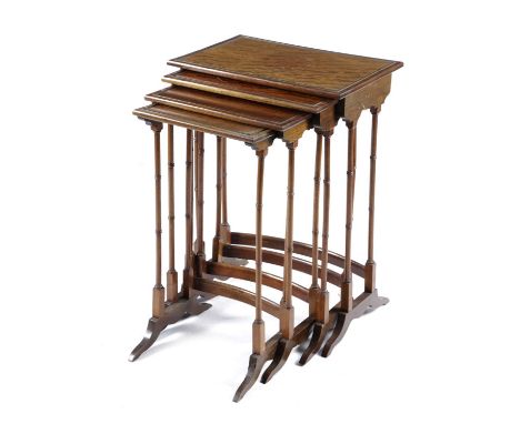 A QUARTETTO NEST OF MAHOGANY OCCASIONAL TABLESIN REGENCY STYLE, 19TH CENTURYeach with an ebonised beaded top on ring turned l