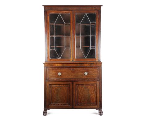 A GEORGE IV MAHOGANY SECRETAIRE BOOKCASEC.1825-30with a pair of geometric astragal glazed doors enclosing adjustable shelves 