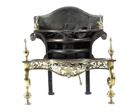 A STEEL AND BRASS FIREGRATEIN GEORGE II STYLE, EARLY 20TH CENTURYwith a cast iron back, urn finials and a pierced serpentine 