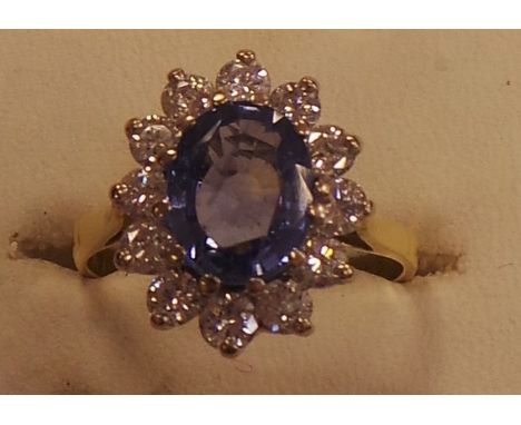 18ct diamond and sapphire cluster ring approx. 1 caret diamond , 2 caret sapphire
