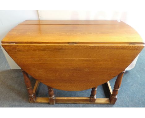 Solid oak gate leg table with oval ends