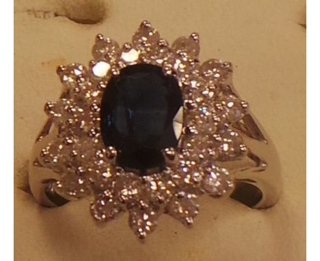 White gold diamond and sapphire cluster ring approx. 1 caret diamond