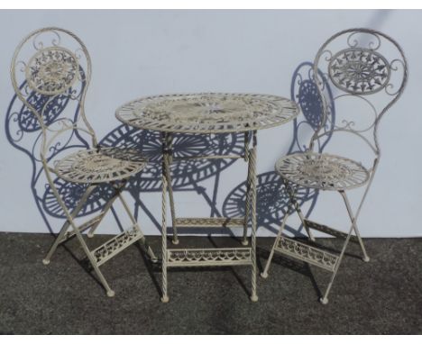 Oval table and two garden chairs