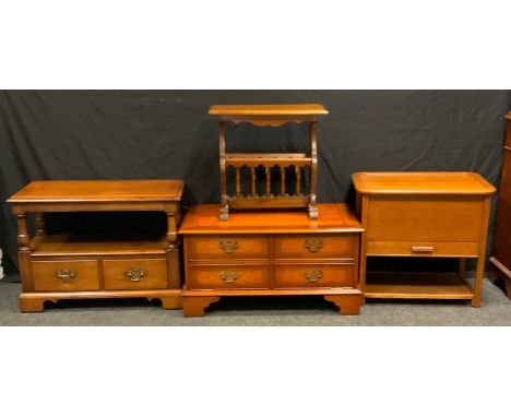 A late 20th century oak two tier hall table, two short drawers, brass handles, bracket feet, 54cm high, 76cm wide, 41cm deep;