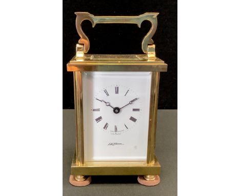 A brass carriage clock by H.L.Brown, Swiss movement, Roman numerals. 15cm high. 
