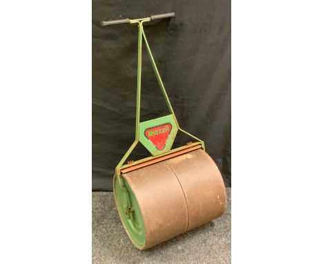 A vintage Uneeda cast iron garden lawn roller, 99cm high, 45cm wide. 
