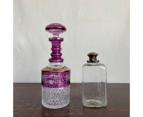 A 20th century Bohemian style cut amethyst crystal decanter along with an early 20th century hallmarked silver mounted spirit