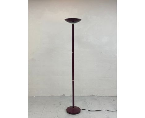 A contemporary lacquered metal floor standing lamp having a splayed uplighter shade on a narrow stem with brass collars raise