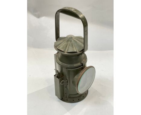 A British military railway hand-held signalling lamp dated 1956 with lenses and burner with wick 
