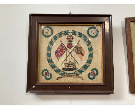 A WWI Hampshire Regiment tapestry together with a Boer War 10th Hussars tapestry, both framed and glazed (2) 