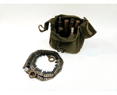 An army saw in canvas webbing case 