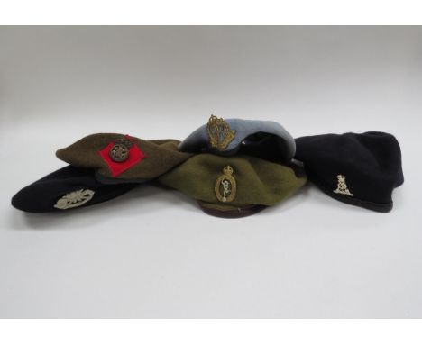 Five various berets with badges including Pioneer Labour Corps, George Crown Military Police, Royal Corps of Signals, Royal W