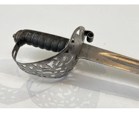 An 1892 Pattern Mark I Household Cavalry Troopers' sword, the pierced steel basket hilt with hollow scroll quillon and wired 
