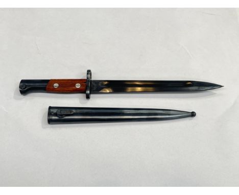 A Russian Mauser bayonet in unissued condition, dated 44, with matching numbered scabbard 