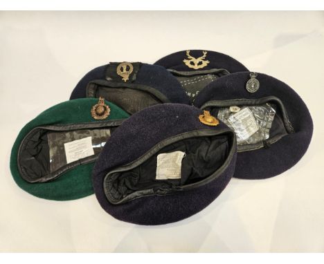 Five various berets with badges including Army Catering Corps, Royal Marines, Scottish Clan and 1953 dated with Highlander ba