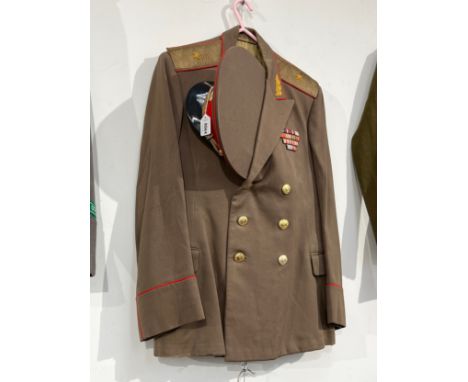 A USSR Russian Soviet Army officer's uniform, peaked visor cap (red band and red piping) together with jacket and trousers 