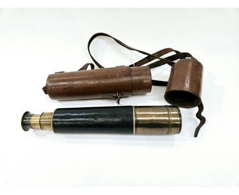 A vintage leather and brass telescope with brown leather case, no visible maker 