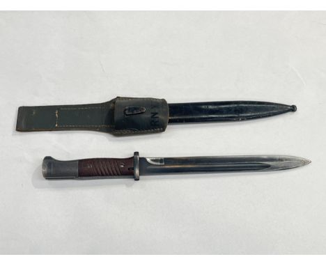 A Third Reich era German K98 Mauser bayonet, Waffen stamped and with 41 crs and 1391 over s stamps, with black painted steel 