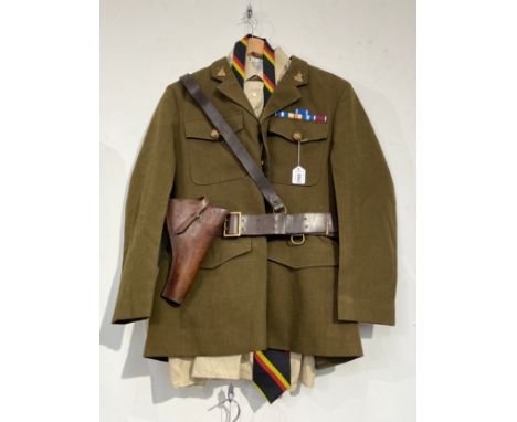 A post-war British Army Service Dress uniform with Norfolk Regiment insignia, together with an earlier brown leather pistol h