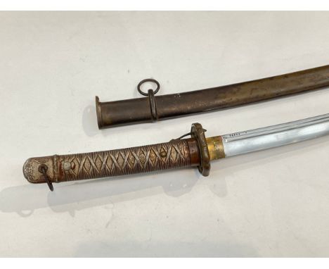 A WWII Japanese NCO’s sword, the alloy grip joining a single fuller curved blade stamped 24655, with scabbard stamped with ma