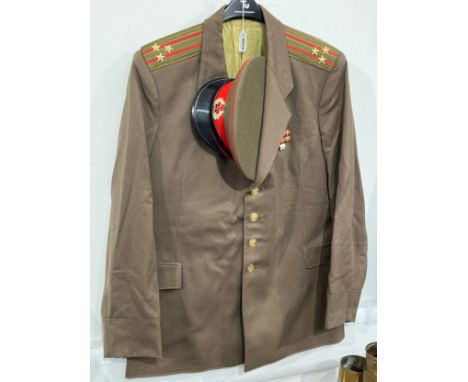 A USSR Russian Soviet Army officer's uniform consisting of peaked visor cap, red band with star, together with jacket 