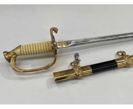 A modern US Naval dress sword with etched fullered blade, marked 'U.S.N.', 'Vanguard France-Lames France', plastic wire-bound