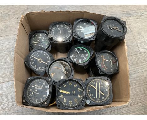 A collection of aircraft cockpit dials including engine RPM and Course Indicator 