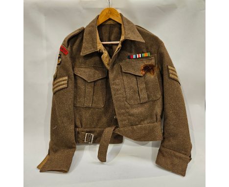 A WWII 1940 Pattern battledress blouse to a Sergeant in the Royal Engineers with correct insignia, damage present 