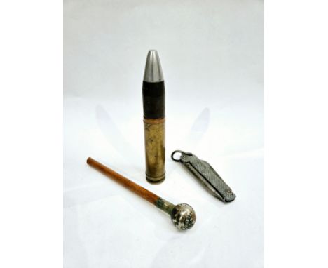 A British Army jack knife, Inniskilling swagger stick top and a 30mm RG56 shell with head (3) 