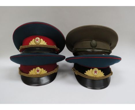 Four USSR Russian Soviet peaked visor caps including Army Officer (dark green with red band and red piping, gilt metal badge)
