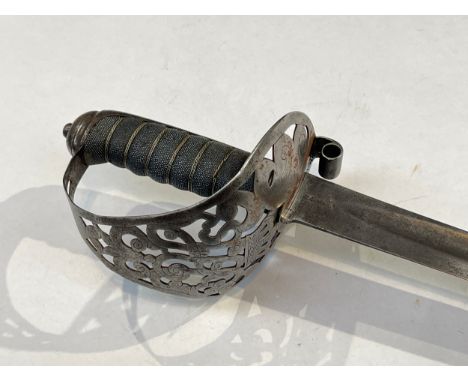 An 1892 Pattern Mark I Household Cavalry Troopers' sword, the pierced steel basket hilt with hollow scroll quillon and wired 
