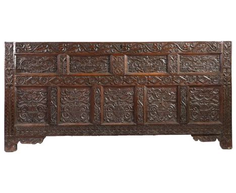 An impressive Charles II oak coffer front, in the Elizabethan manner, Lancashire, dated 1669With four slender panels, each ca