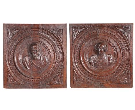 An impressive, large, pair of mid-16th century oak Romayne-type portrait panels, Anglo-Flemish, circa 1540-60Carved in very h