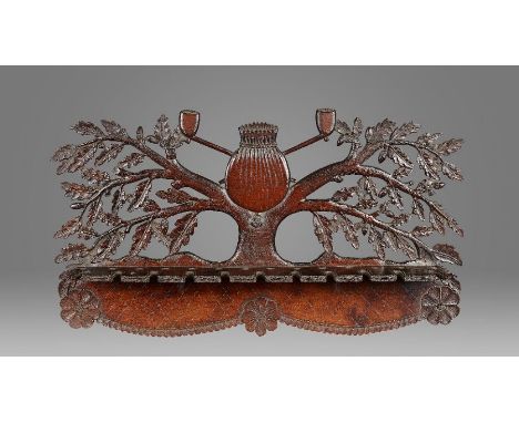 An unusual walnut pipe rack, Anglo-American, circa 1800-50Designed as an oak tree, with leaves and acorns, centred by a sporr