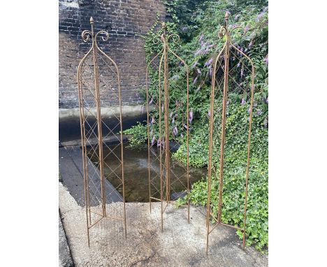 ARCHITECTURAL GARDEN OBELISKS, a set of three, 180cm high, 40cm diameter, painted metal. (3) 