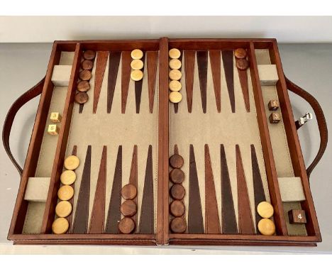 BACKGAMMON SET, in leathered case, 7cm x 23cm x 40cm. 