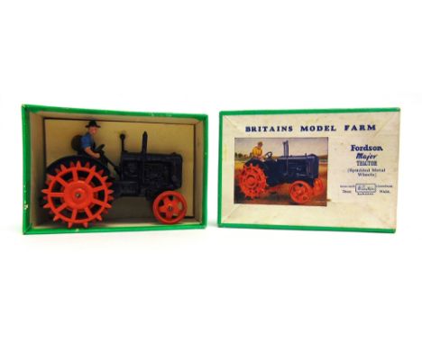 A BRITAINS NO.127F, FORDSON MAJOR TRACTOR WITH SPUDDED WHEELS  dark blue with orange wheels, complete with driver figure, ver