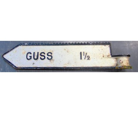 A CAST IRON SIGN-POST ARM 'GUSS'  with a serated upper edge, 103.5cm long.