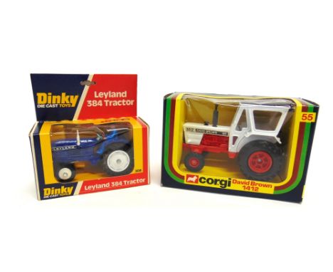 TWO DIECAST MODEL TRACTORS  comprising a Dinky No.308, Leyland 384 Tractor, dark blue with white hubs, mint, boxed; and a Cor