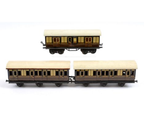 [O GAUGE]. THREE BING G.W.R. COACHES  comprising a pair of six-wheel first-third composite coaches (one with applied company 