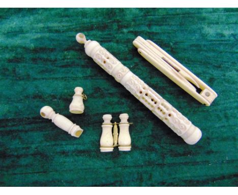 FIVE STANHOPE OPTICAL NOVELTIES  comprising a carved ivory needle case, 'Souvenir of the Exposition 1867', 10.5cm long; a car