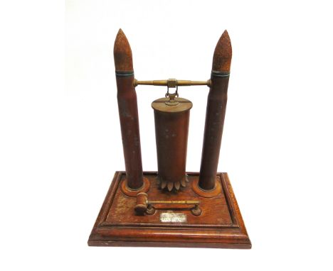 [NAVAL INTEREST]. A TRENCH ART PRESENTATION TABLE GONG  comprising an inverted shell case with a cut, flared rim, suspended b