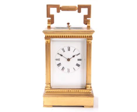 A FRENCH LATE 19th CENTURY MUSICAL REPEATING CARRIAGE CLOCK the gilt brass case with reeded columns enclosing an enamel Roman