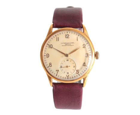 A GENTLEMAN'S 1950's GOLD PLATED IWC WRIST WATCH on a maroon leather strap, the circular case enclosing a cream dial with gol