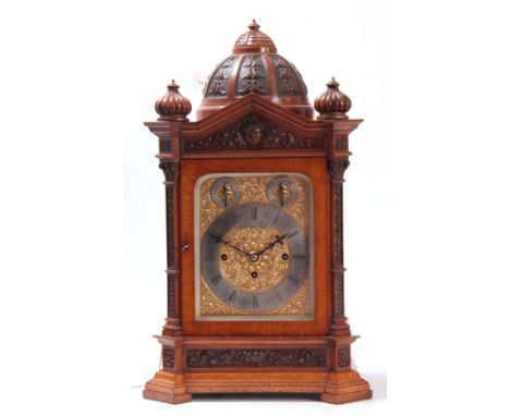 A LATE 19th CENTURY QUARTER CHIMING TRIPLE FUSEE BRACKET CLOCK the fine architectural figured oak case having a carved domed 