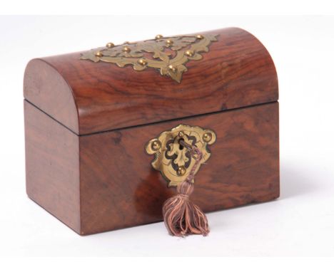 A VICTORIAN DOME TOP FIGURED WALNUT TEA CADDY with lidded divided interior and applied engraved brass fret-cut decoration 17.