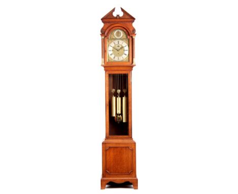 MAPLE &amp; CO. LONDON. AN EARLY 20th CENTURY OAK CASED QUARTER CHIMING LONGCASE CLOCK the hood having an architectural pedim