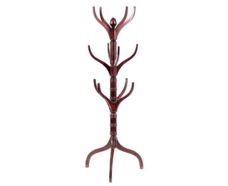 A REGENCY MAHOGANY COAT STAND with splayed branches and turned tapering column, acorn finial and splayed leg supports 152cm h