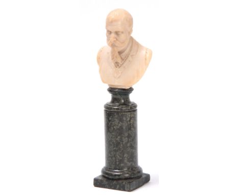 A 19TH CENTURY ALABASTER CARVED BUST PORTRAIT OF KING GEORGE V mounted on a turned green-veined marble socle 26cm high. 